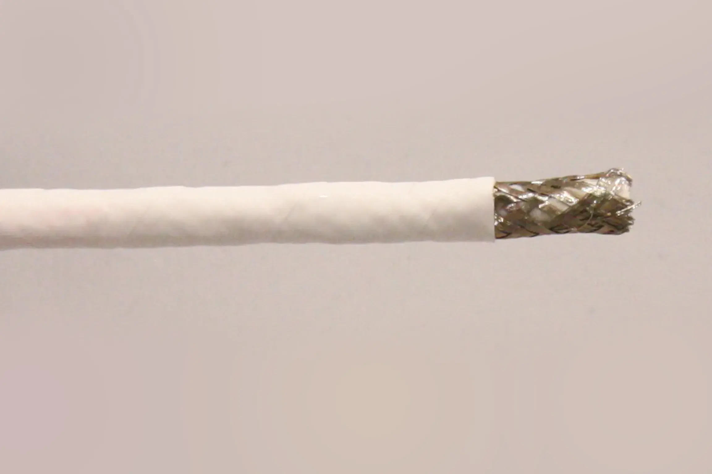 silver colored wire inside wrapper of white color.